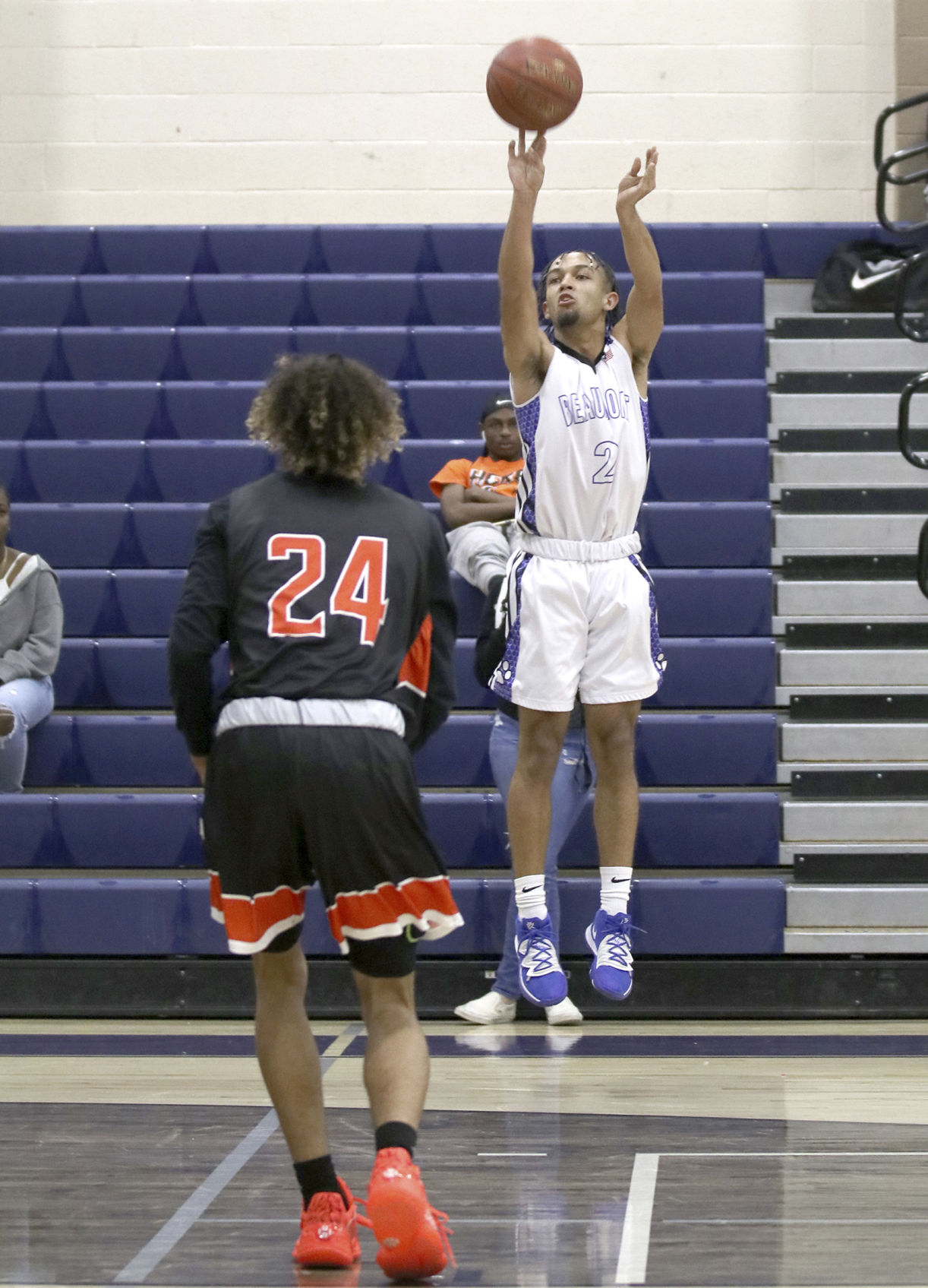 Cougar Austin Sims shoots up and over San Jacinto's Antoine Sullivan last Tuesday.